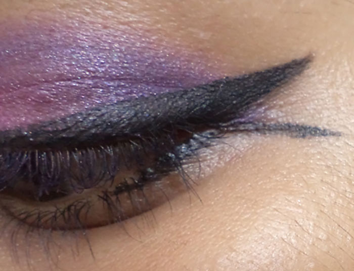 Purple eye makeup step 8 is to create a fishtail Purple eye makeup step 8 is to create a fishtail