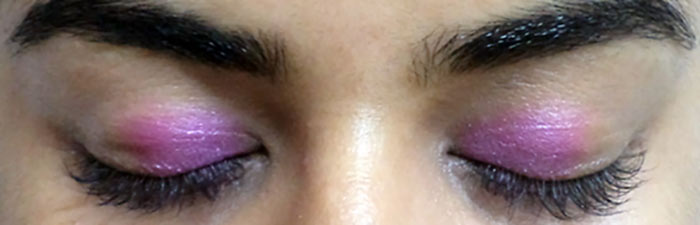 Purple eye makeup step 2 is to apply bright pink color Purple eye makeup step 2 is to apply bright pink color