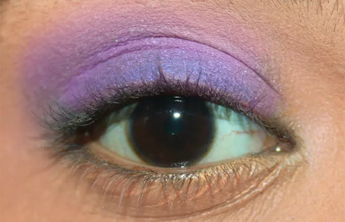 Purple eye makeup step 17 is to apply matte soft purple eyeshadow