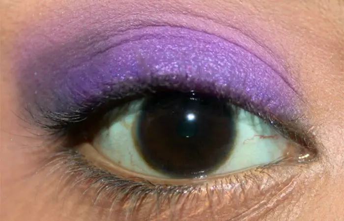 Purple eye makeup step 20 is to apply matte indigo blue eyeshadow