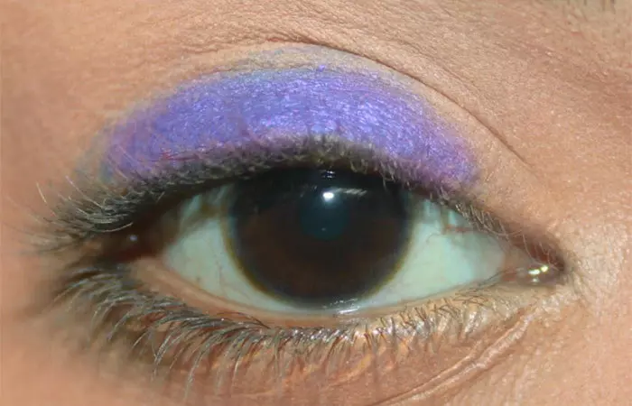 Purple eye makeup step 16 is to apply purple base on eyelid