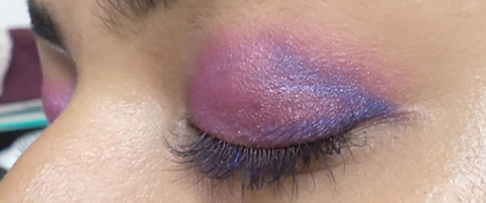 Purple eye makeup step 5 is to apply blue shade Purple eye makeup step 5 is to apply blue shade