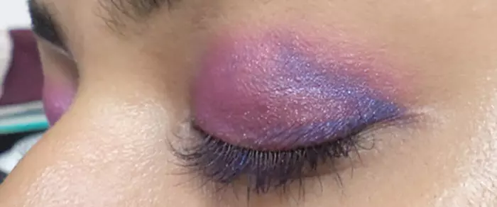 Purple eye makeup step 5 is to apply blue shade