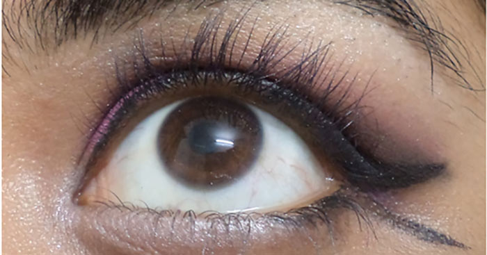 Purple eye makeup step 12 is to apply white color Purple eye makeup step 12 is to apply white color
