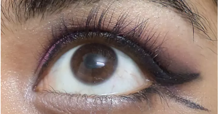 Purple eye makeup step 12 is to apply white color