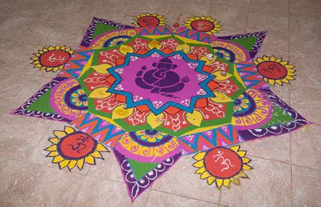 Freehand rangoli design with lord Ganesha at the centre
