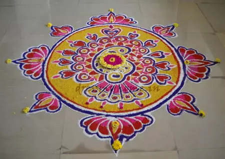 Freehand peacock rangoli design with floral borders