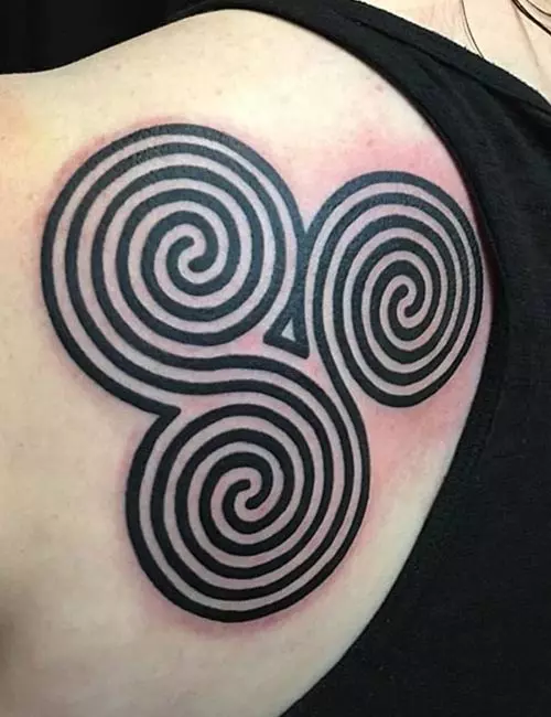 Spiraling Tribal Back Tattoos