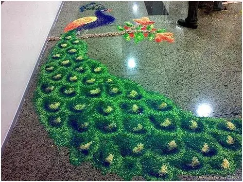 A full bodied peacock perched on a branch for rangoli design