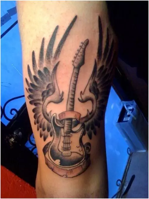 guitar tattoo on hand