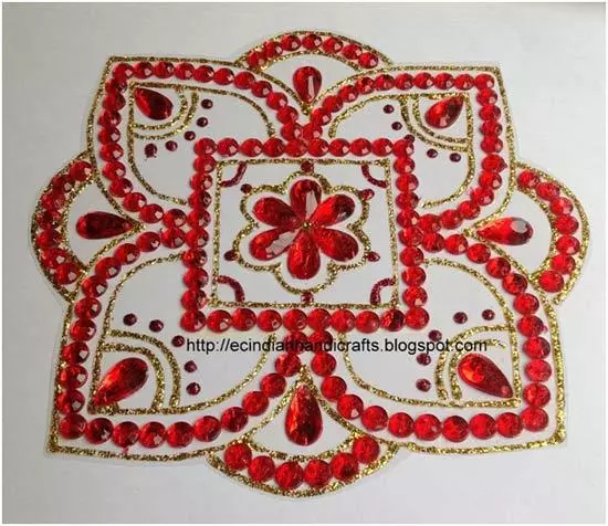 red kundan rangoli