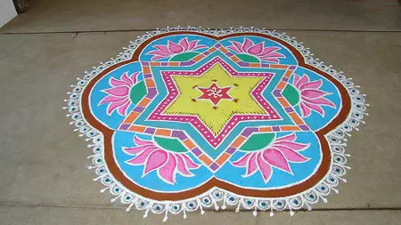 Freehand rangoli design with lotus and star patterns