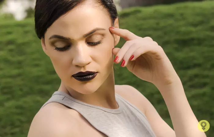 The final look of a woman wearing black lipstick