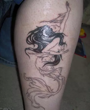 A black and white mermaid tattoo