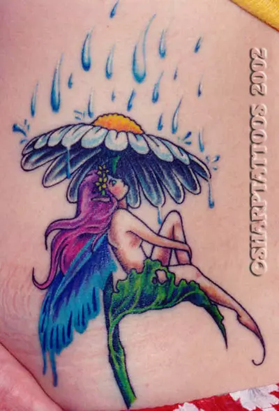 A fairy taking shelter from rain tattoo