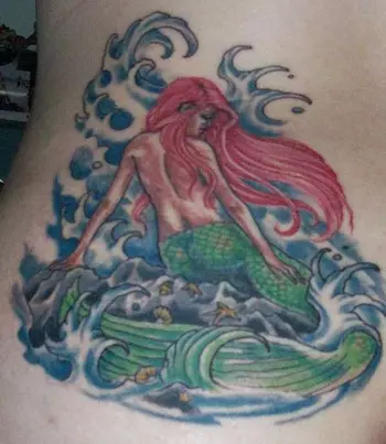 A mermaid with her back turned tattoo