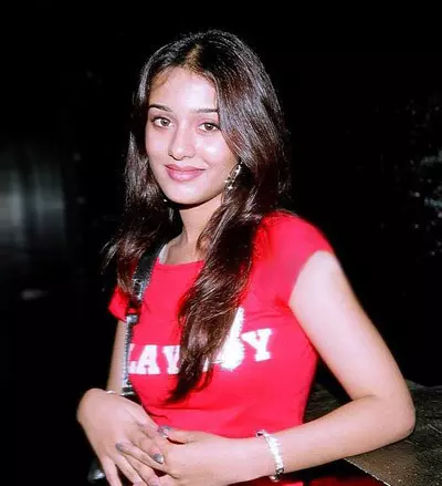 Amrita looks simple with a red Playboy T-shirt