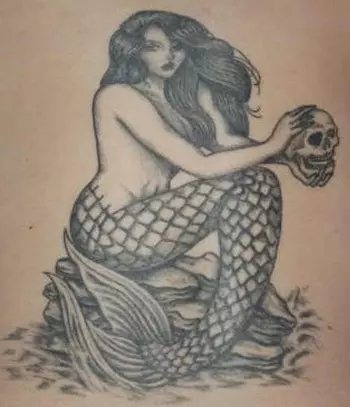 Mermaid on the rocks tattoo