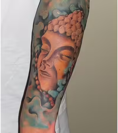 buddha face tattoo