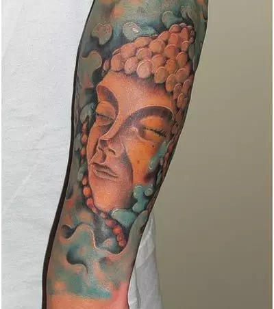 buddha face tattoo