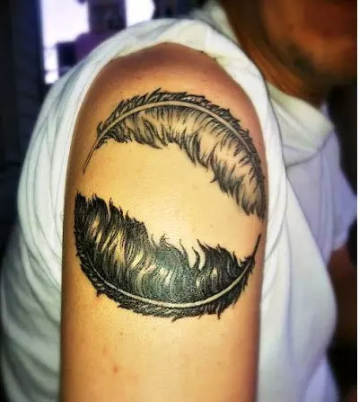 feather yin yang tattoo