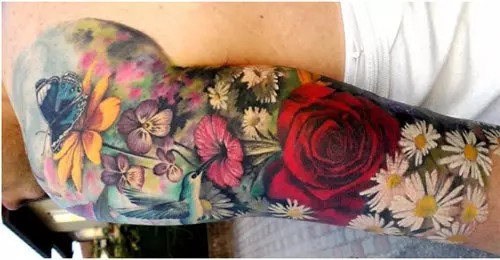 Colored Daisies Arm Tattoo