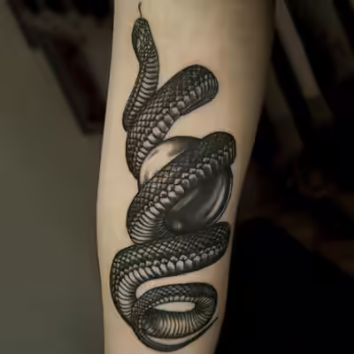 snake forearm tattoo