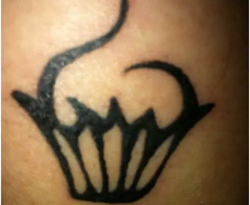 subtle black cupcake tattoo