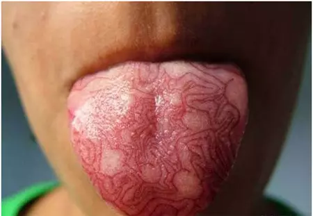 Subtle Tongue Tattoo