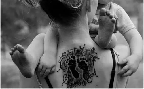 Upper Back Footprint Tattoo