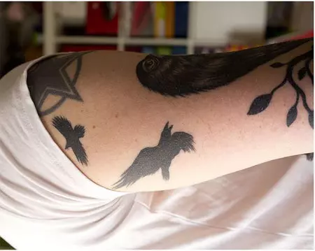 flying raven tattoo