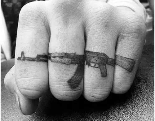 gun finger tattoo