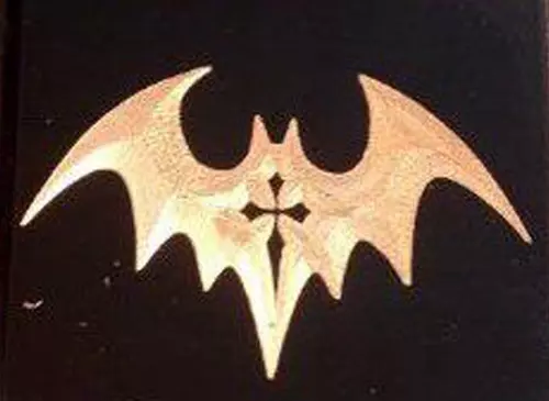 Bat motif with crucifix tattoo