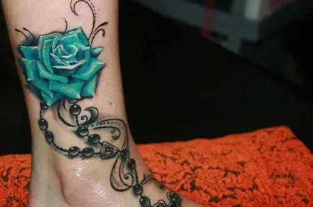 Beads, cross and rose tattoo