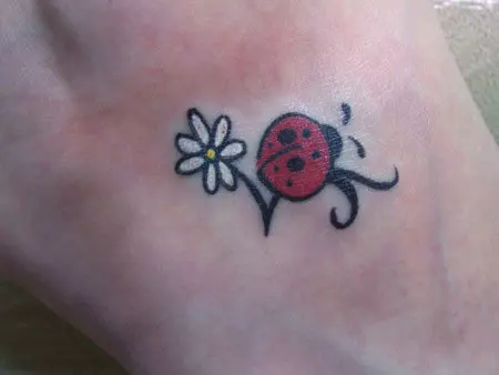  Ladybug with White flower Tattoo