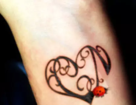 Ornate heart and Ladybug Tattoo