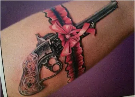 pink gun tattoo