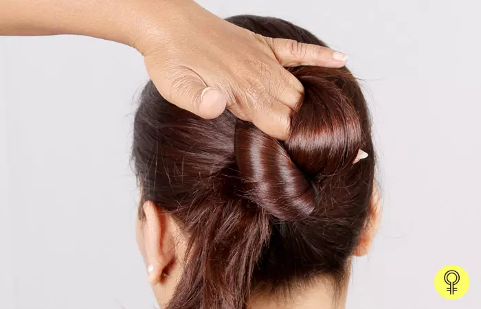 Starting at the base of the ponytail