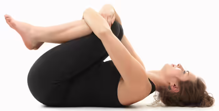 Ramdev Yoga For Rheumatoid Arthritis - Knee To Chest Pose Image: Shutterstock