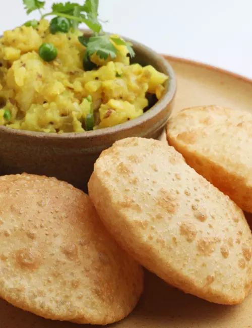 Bengali luchi aloor torkari is an east Indian vegetarian breakfast food