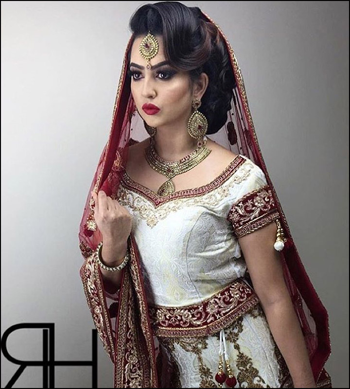 Indian Bridal Hairstyles - Side Styled Bouffant With Large Wavy Curly Bun With Veil And Maang Tikka