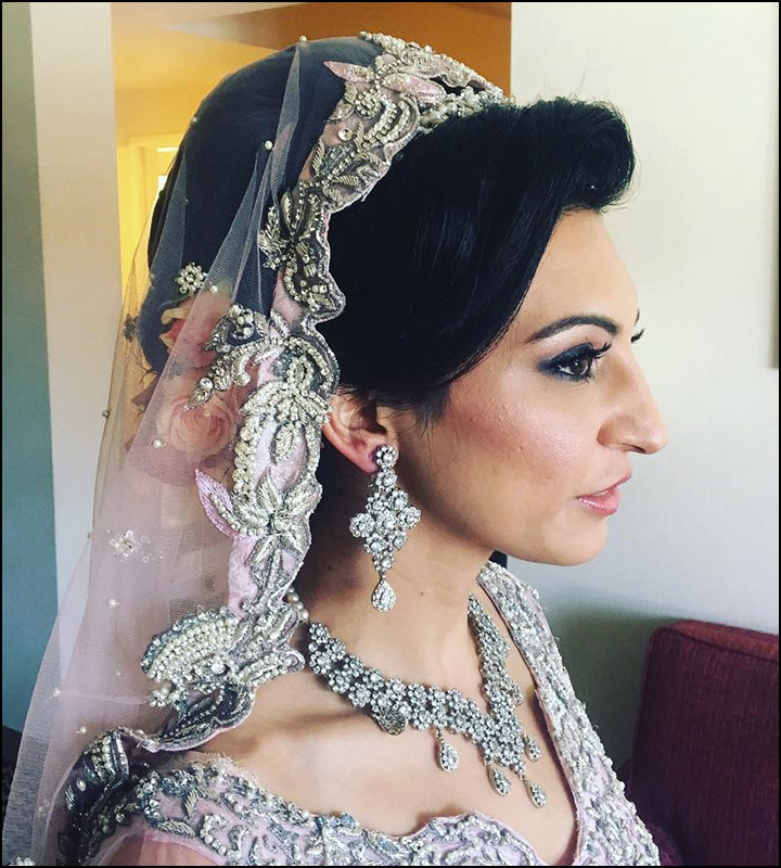 Indian Bridal Hairstyles - The Simple Bun Worn Up With See Through Veil And Neckpiece