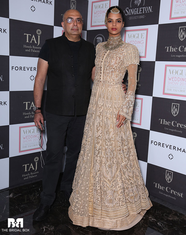 Tarun-Tahiliani-with-a-model-in-his-creation-at-Day-2-of-the-Vogue-