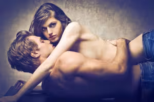 Beautiful-couple-lying-on-a-table-and-hugging