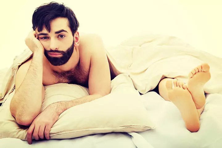 Young-handsome-depressed-man-in-bed