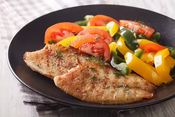 Crispy fish steaks and veggies with sauce Crispy fish steaks and veggies with sauce