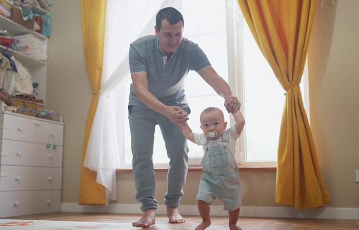 The first time papa tries to teach him walking.