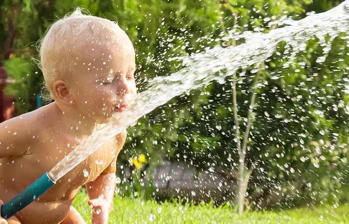 The first time this baby handles a hose