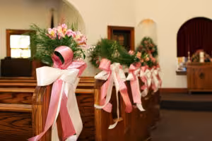 Wedding-Pew-Decorations-with-Pink-&-White-Ribbons