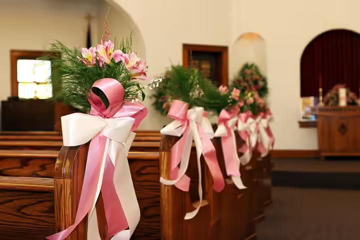 Wedding-Pew-Decorations-with-Pink-&-White-Ribbons